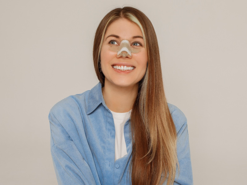 Rhinoplasty patient in recovery procesa