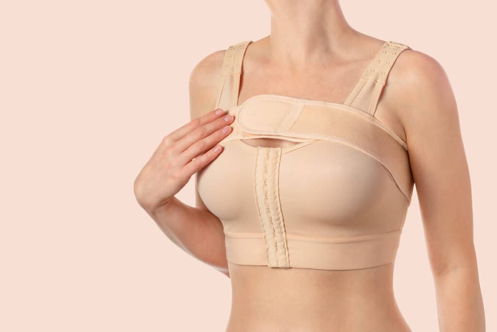  Close-up of a post-surgery bra for breast augmentation preparation.