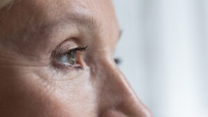 Close-up of a woman's eye, showcasing brow lift effects for a youthful appearance.